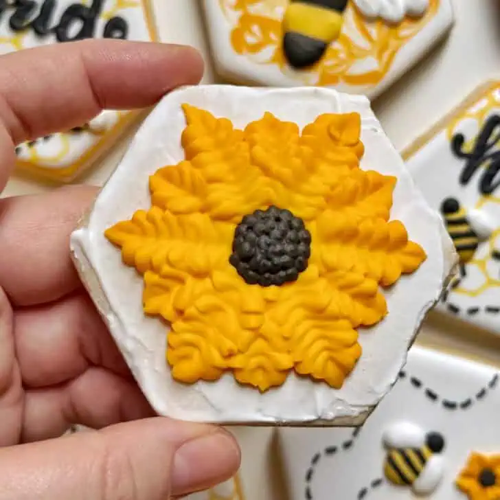 example of royal icing petals piped with a tipless piping bag