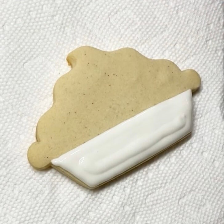 Step-by-step decorating instructions for how to decorate lemon pie cookies with royal icing