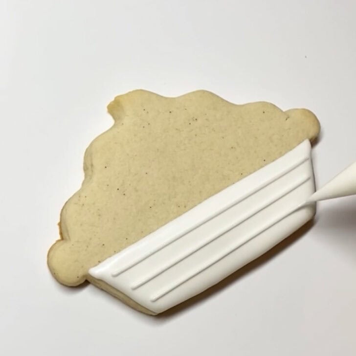 Step-by-step decorating instructions for how to decorate lemon pie cookies with royal icing