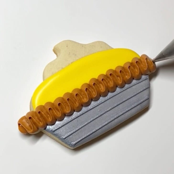 Step-by-step decorating instructions for how to decorate lemon pie cookies with royal icing