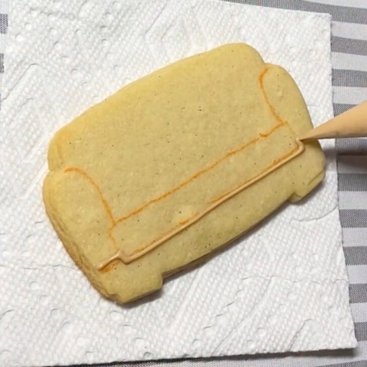 Step-by-step decorating instructions for how to decorate couch cookies with royal icing