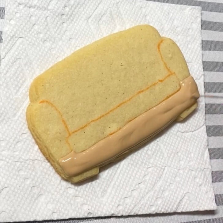 Step-by-step decorating instructions for how to decorate couch cookies with royal icing