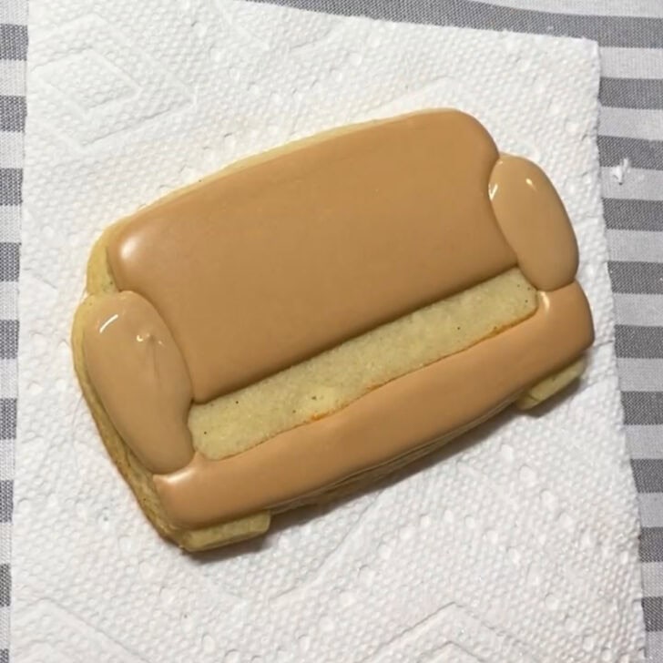 Step-by-step decorating instructions for how to decorate couch cookies with royal icing