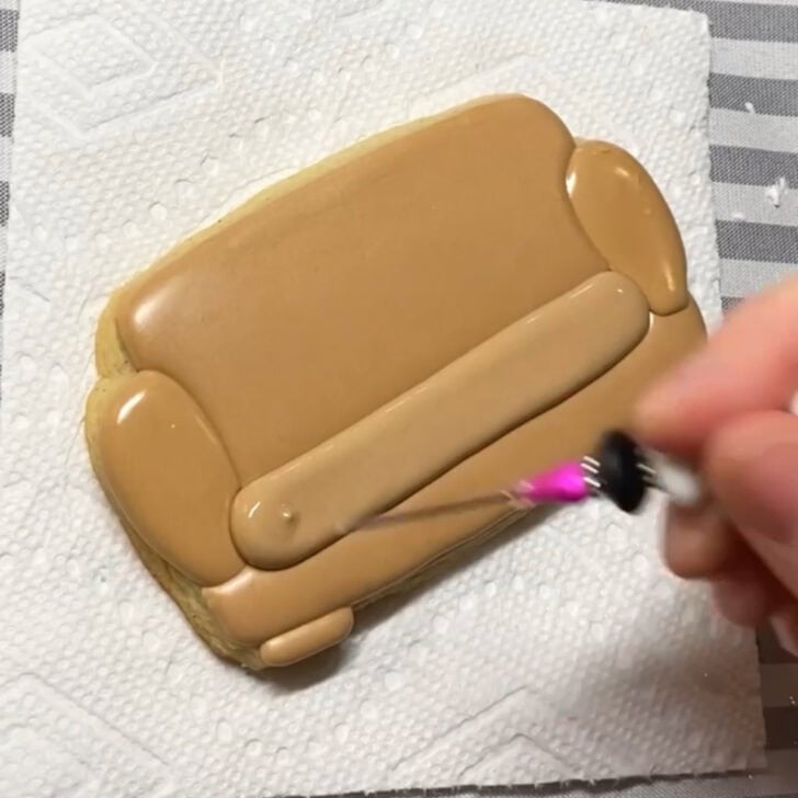 Step-by-step decorating instructions for how to decorate couch cookies with royal icing