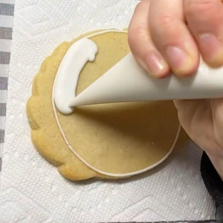 Step-by-step decorating instructions for how to decorate place card cookies with royal icing