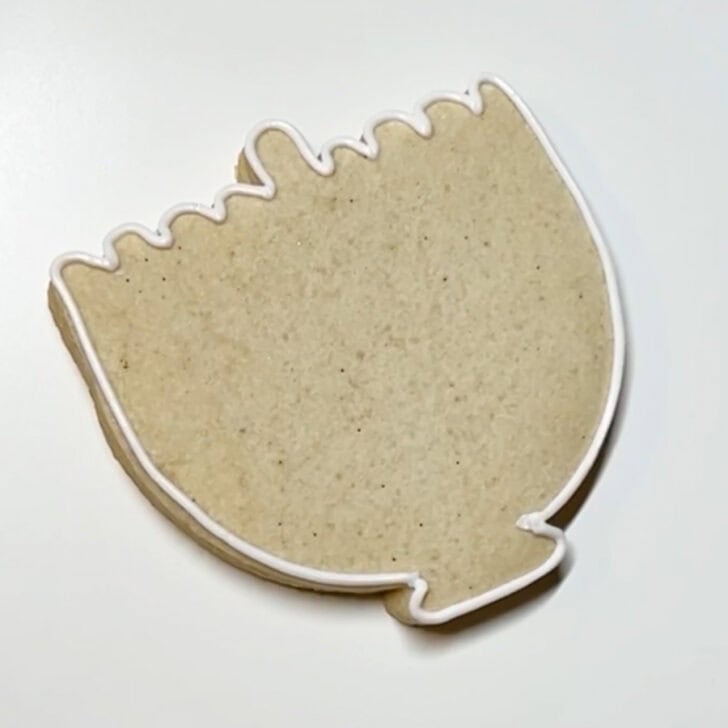 Step-by-step decorating instructions for how to decorate menorah cookies with royal icing