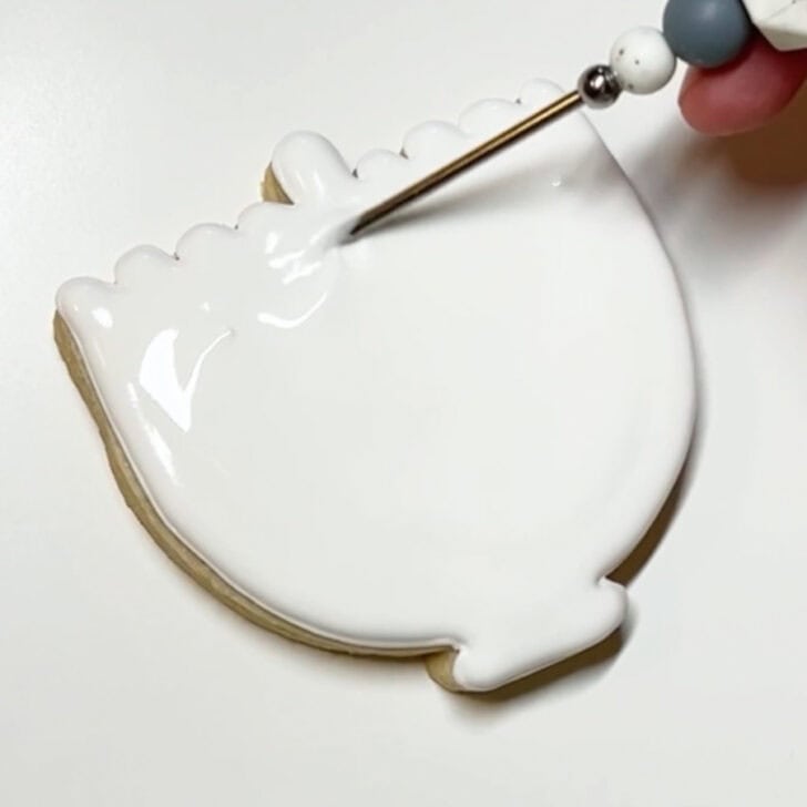 Step-by-step decorating instructions for how to decorate menorah cookies with royal icing