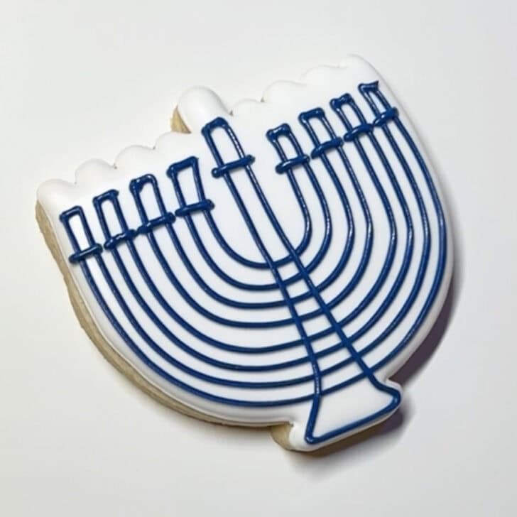 Step-by-step decorating instructions for how to decorate menorah cookies with royal icing