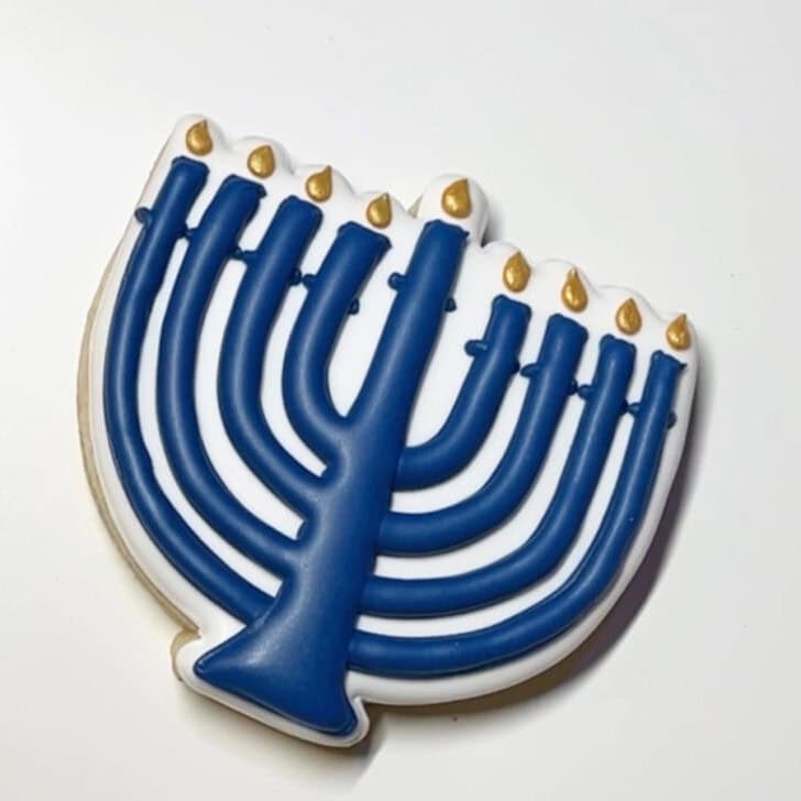 Step-by-step decorating instructions for how to decorate menorah cookies with royal icing