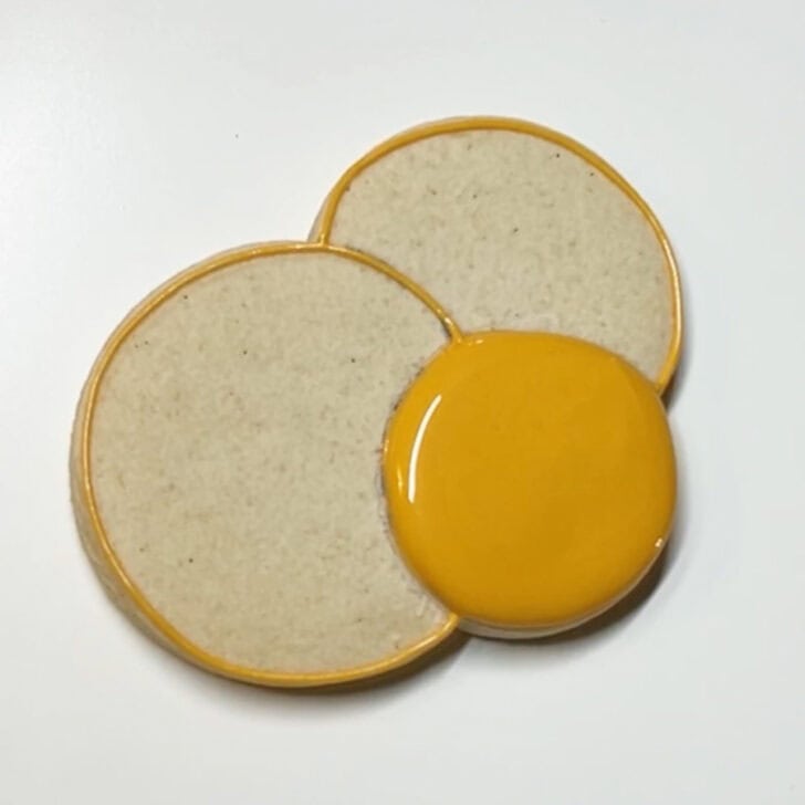 Step-by-step decorating instructions for how to decorate Hanukkah gelt cookies with royal icing