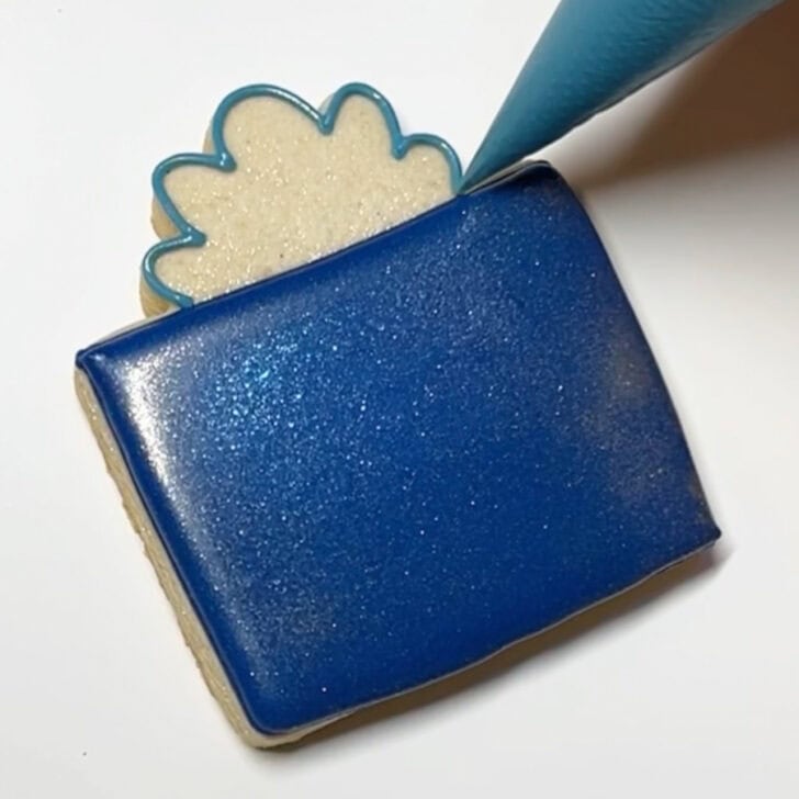 Step-by-step decorating instructions for how to decorate present cookies with royal icing