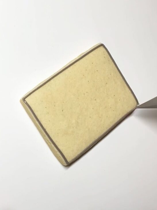 Step-by-step decorating instructions for how to decorate cookie sheet cookies with royal icing