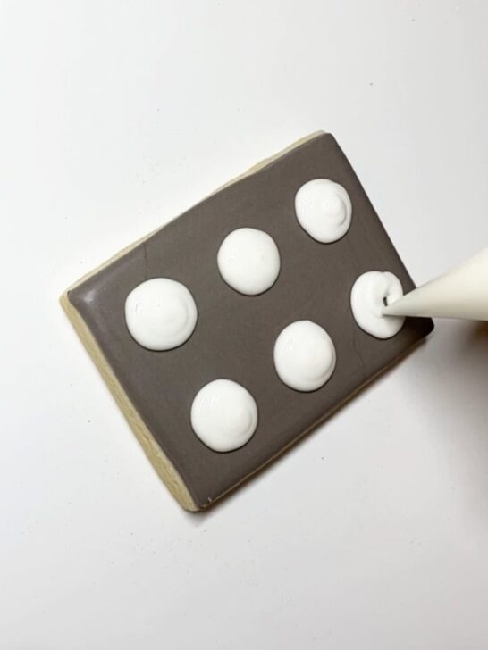 Step-by-step decorating instructions for how to decorate cookie sheet cookies with royal icing