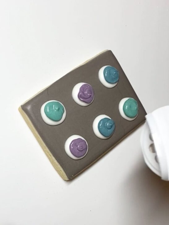 Step-by-step decorating instructions for how to decorate cookie sheet cookies with royal icing