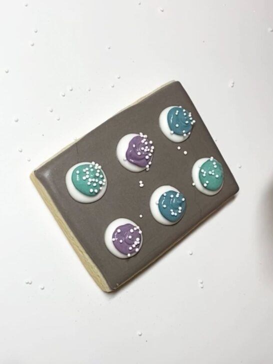 Step-by-step decorating instructions for how to decorate cookie sheet cookies with royal icing