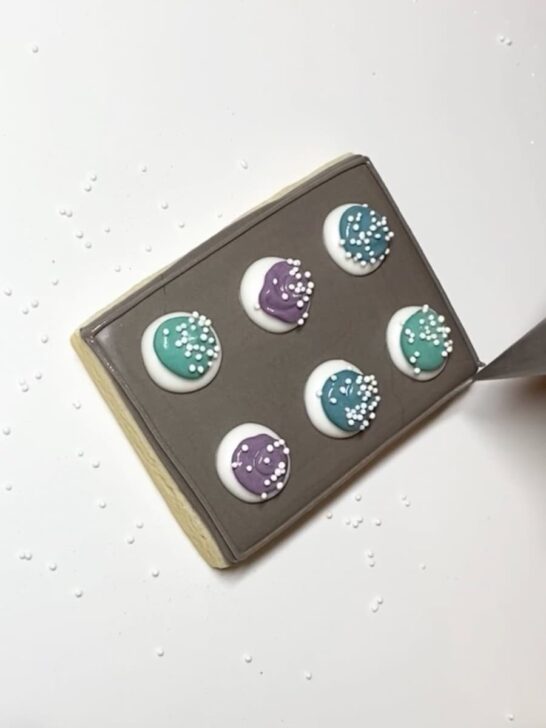 Step-by-step decorating instructions for how to decorate cookie sheet cookies with royal icing