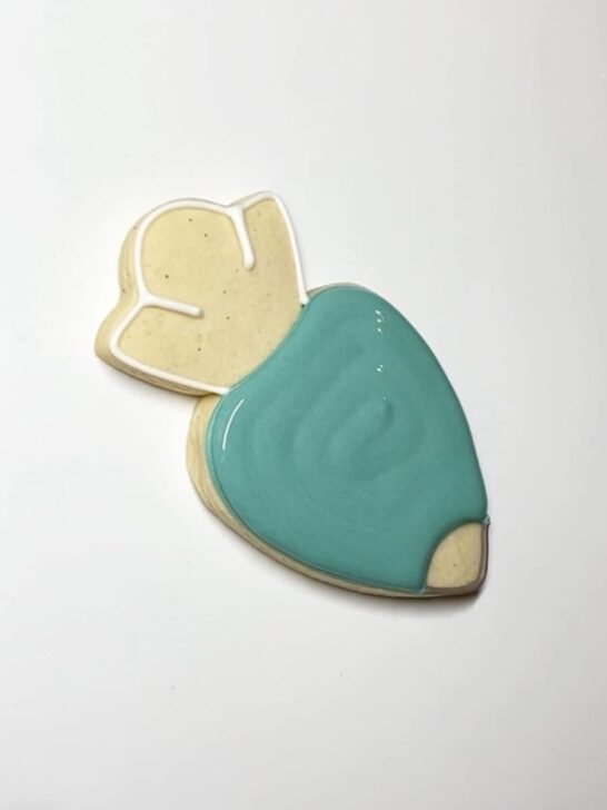 Step-by-step decorating instructions for how to decorate piping bag cookies with royal icing
