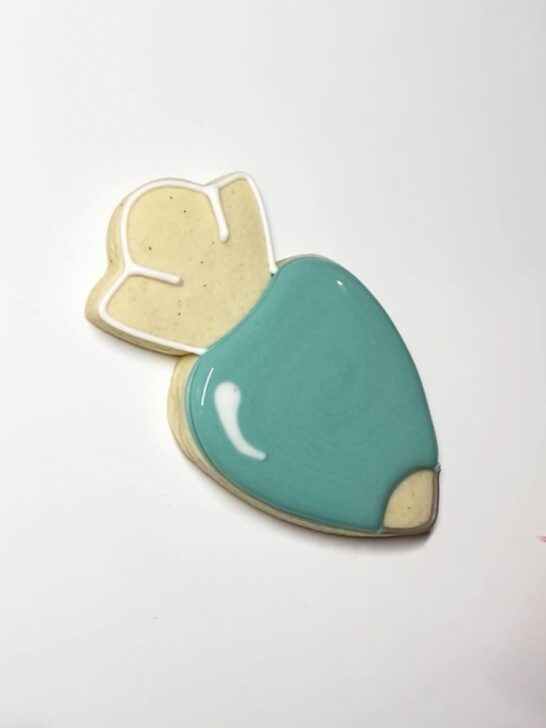 Step-by-step decorating instructions for how to decorate piping bag cookies with royal icing