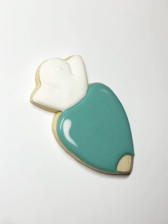 Step-by-step decorating instructions for how to decorate piping bag cookies with royal icing