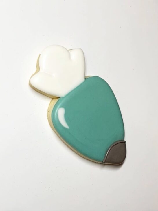 Step-by-step decorating instructions for how to decorate piping bag cookies with royal icing