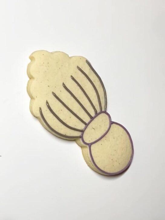 Step-by-step instructions for how to decorate whisk cookies with royal icing