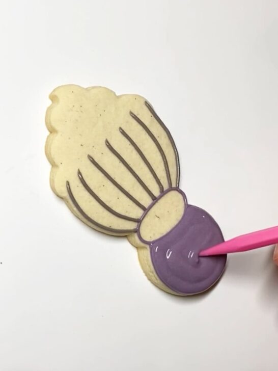 Step-by-step instructions for how to decorate whisk cookies with royal icing
