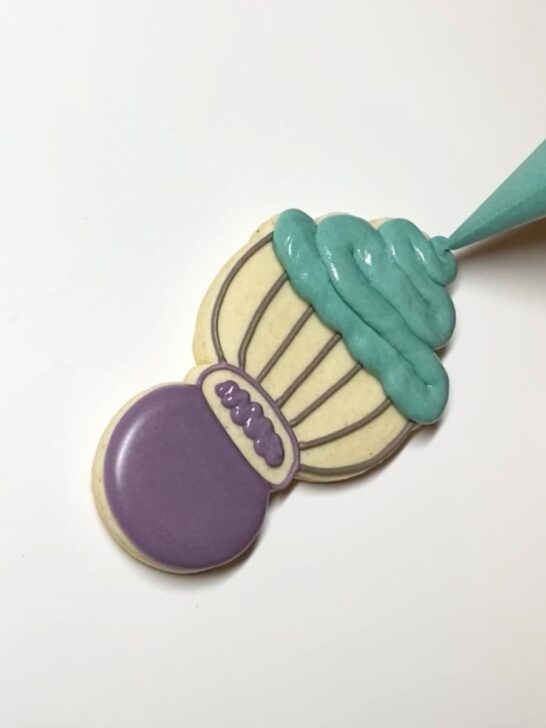 Step-by-step instructions for how to decorate whisk cookies with royal icing