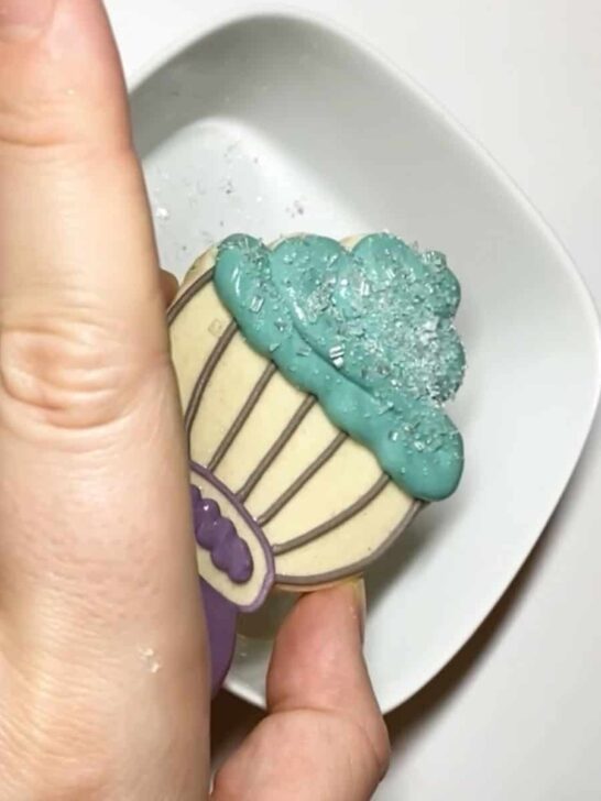 Step-by-step instructions for how to decorate whisk cookies with royal icing