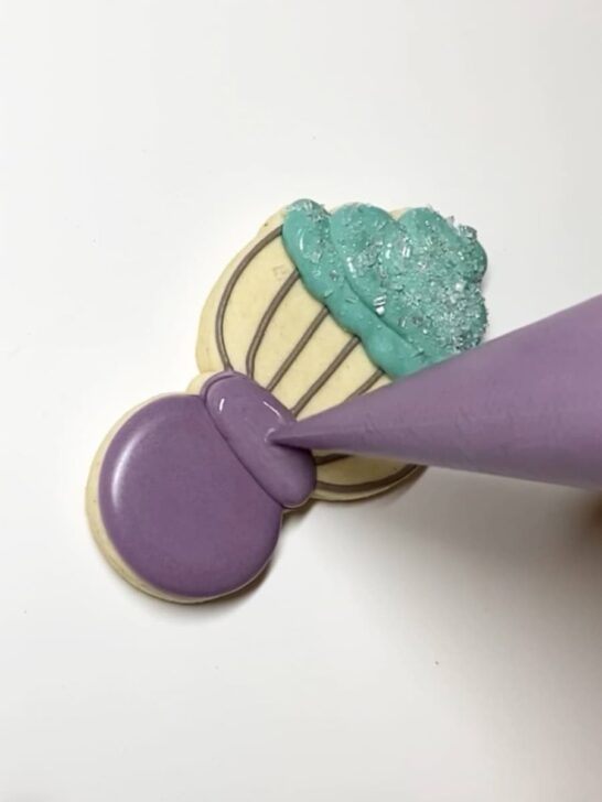 Step-by-step instructions for how to decorate whisk cookies with royal icing