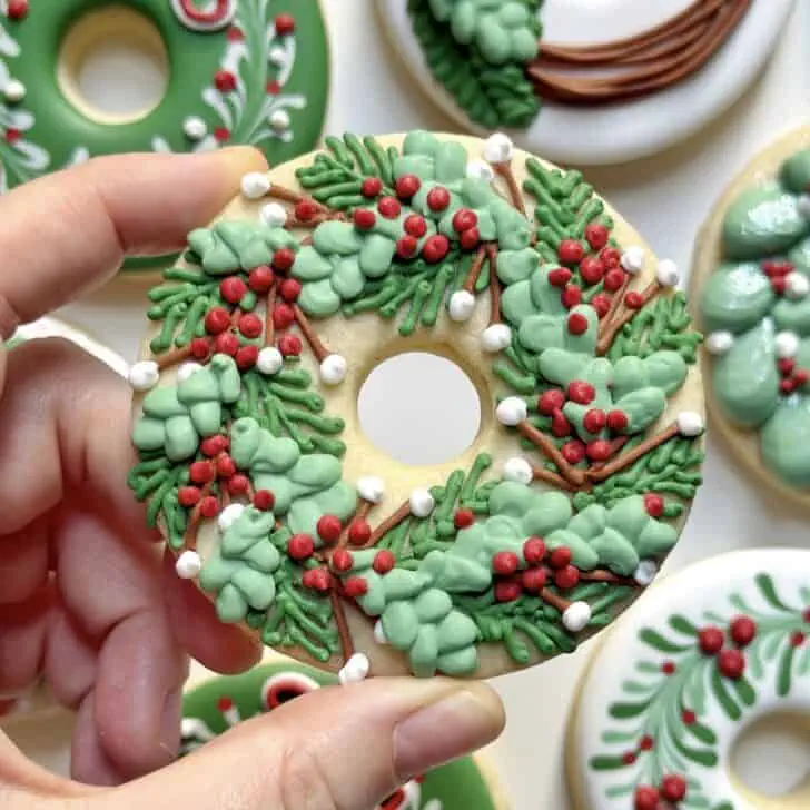 christmas wreath cookies decorated with royal icing