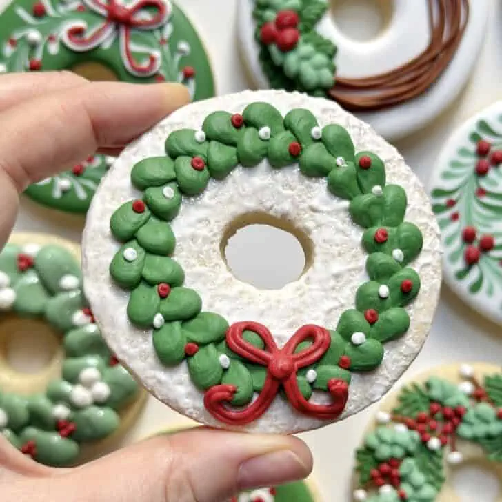 christmas wreath cookies decorated with royal icing