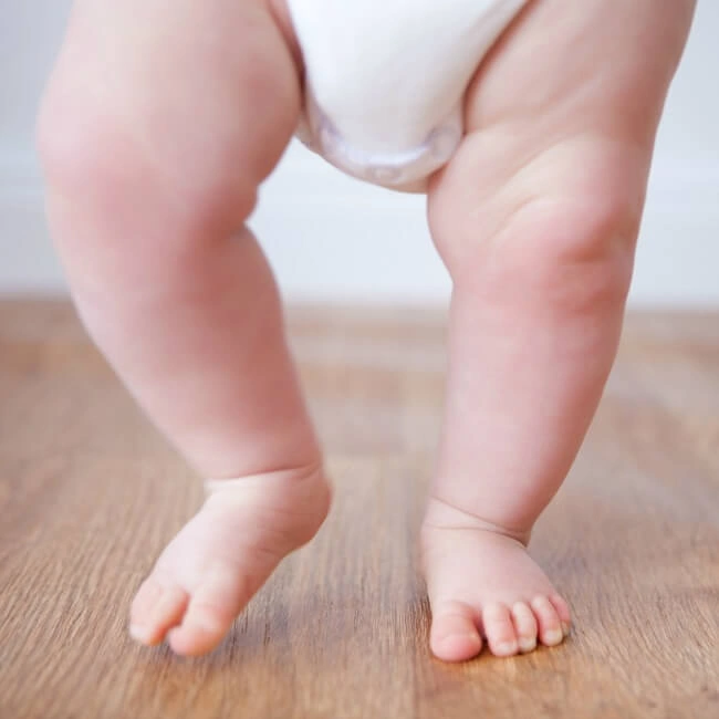 The Inspired Treehouse - Is your little one is learning to walk? Learn more and find some tips to support this important developmental skill.