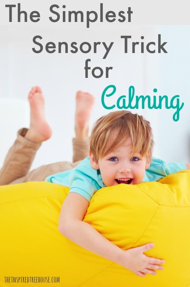 Child lying on a yellow bean bag getting deep pressure input with text that reads The Simplest Sensory Trick for Calming