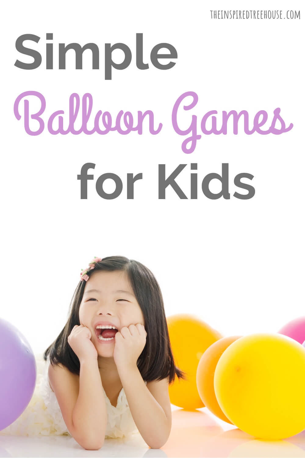 little girl smiling with balloons