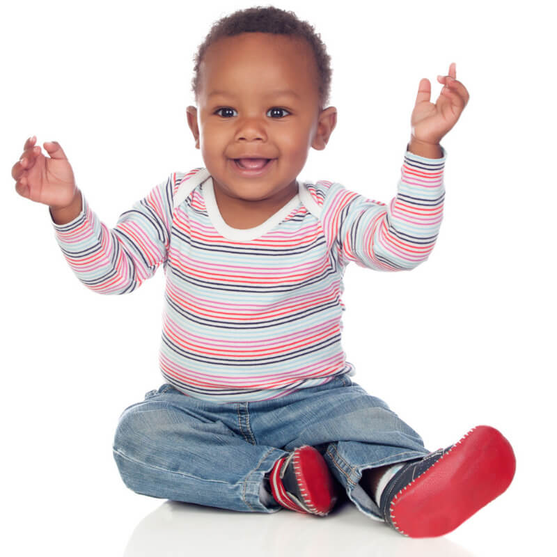 Baby sitting and smiling