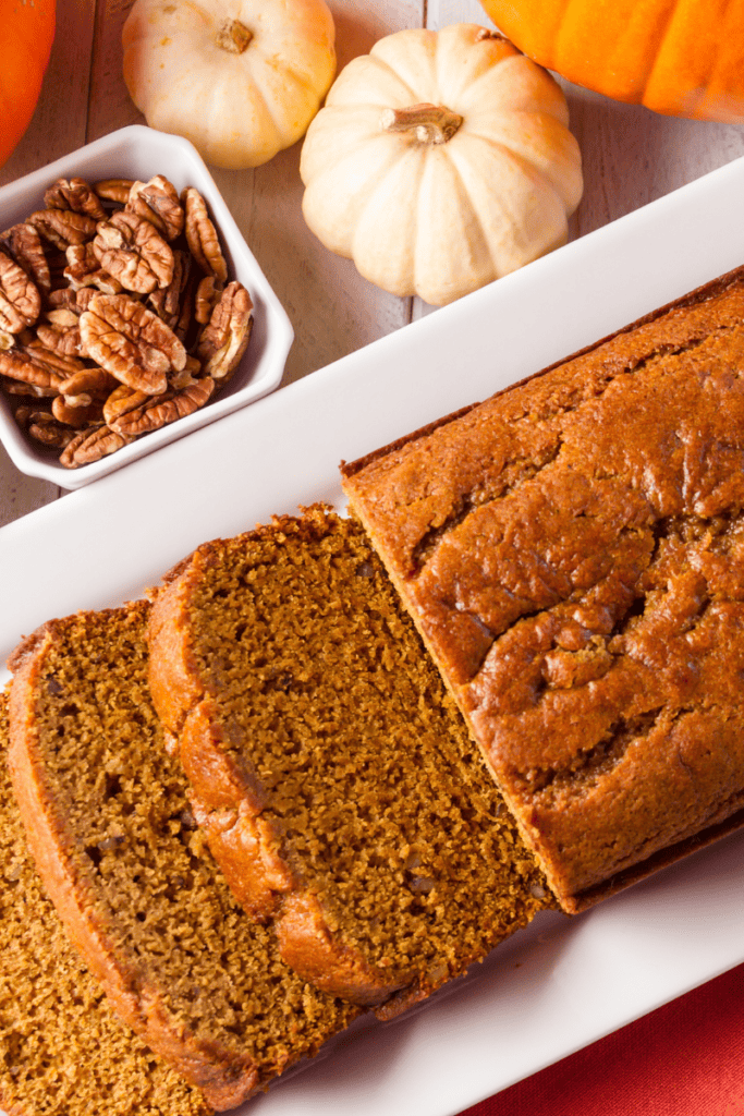 Easy Gluten Free Pumpkin Recipes. Pumpkin bread, bowl of pecans, mini pumpkins