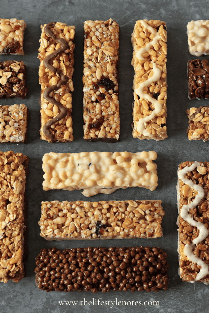 What to Look for in a Protein Bar. Assorted unwrapped protein bars on table.