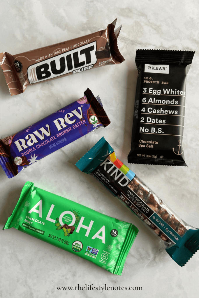 Protein Bars. Picture of Built Puff bar, Raw Rev bar, Rx bar, Kind Nut bar, and Aloha bar.