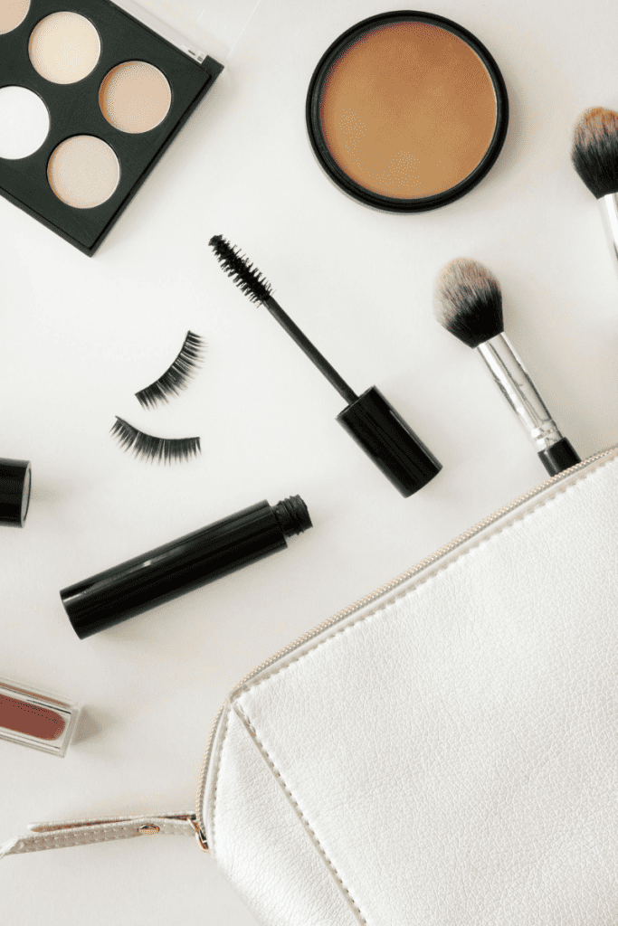 How To Spring Clean and Refresh Your Makeup Bag. White makeup bag with makeup.
