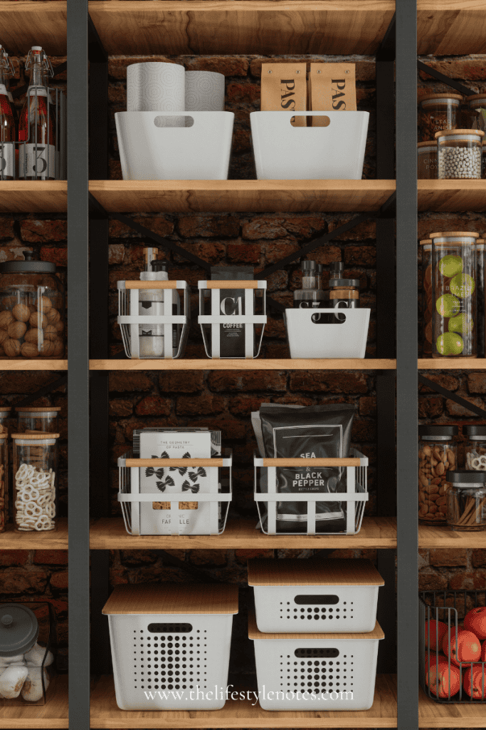 Pantry with wooden shelves and white metal baskets with pantry supplies. Glass jars with spices, nuts and foods.