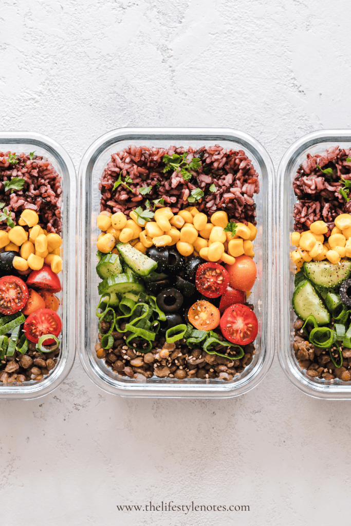Easy Meal Prep for Busy Moms. Containers of meal prepped salad with a variety of vegetables.