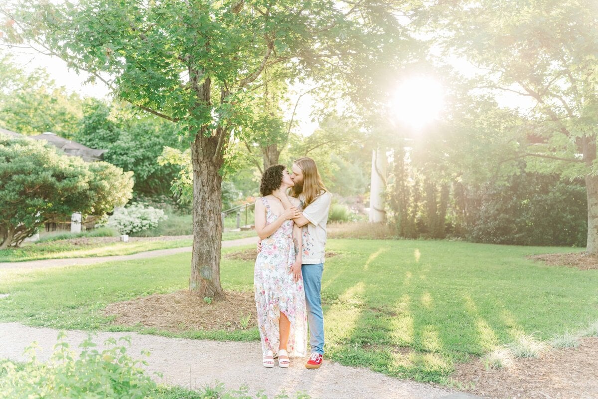 Soft sunset lighting during a botanical garden engagement shoot in North Carolina