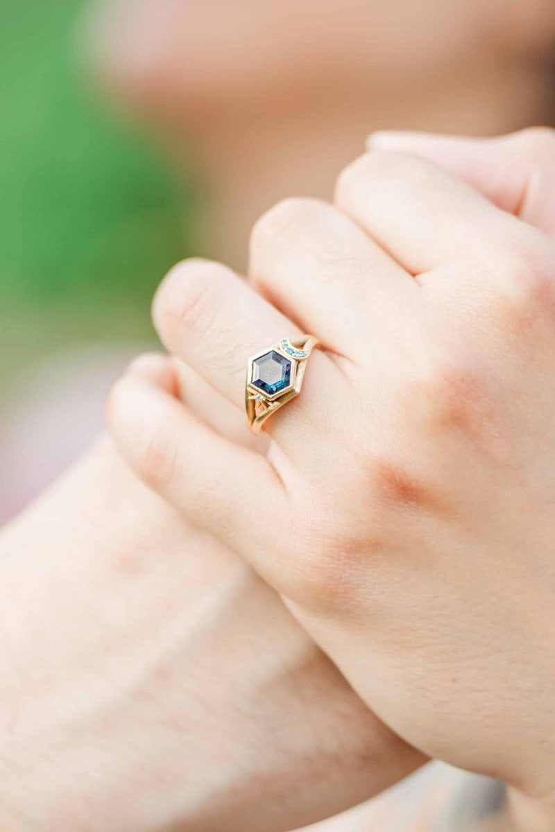 Engagement ring detail shot on blooming flowers at Daniel Stowe Conservancy