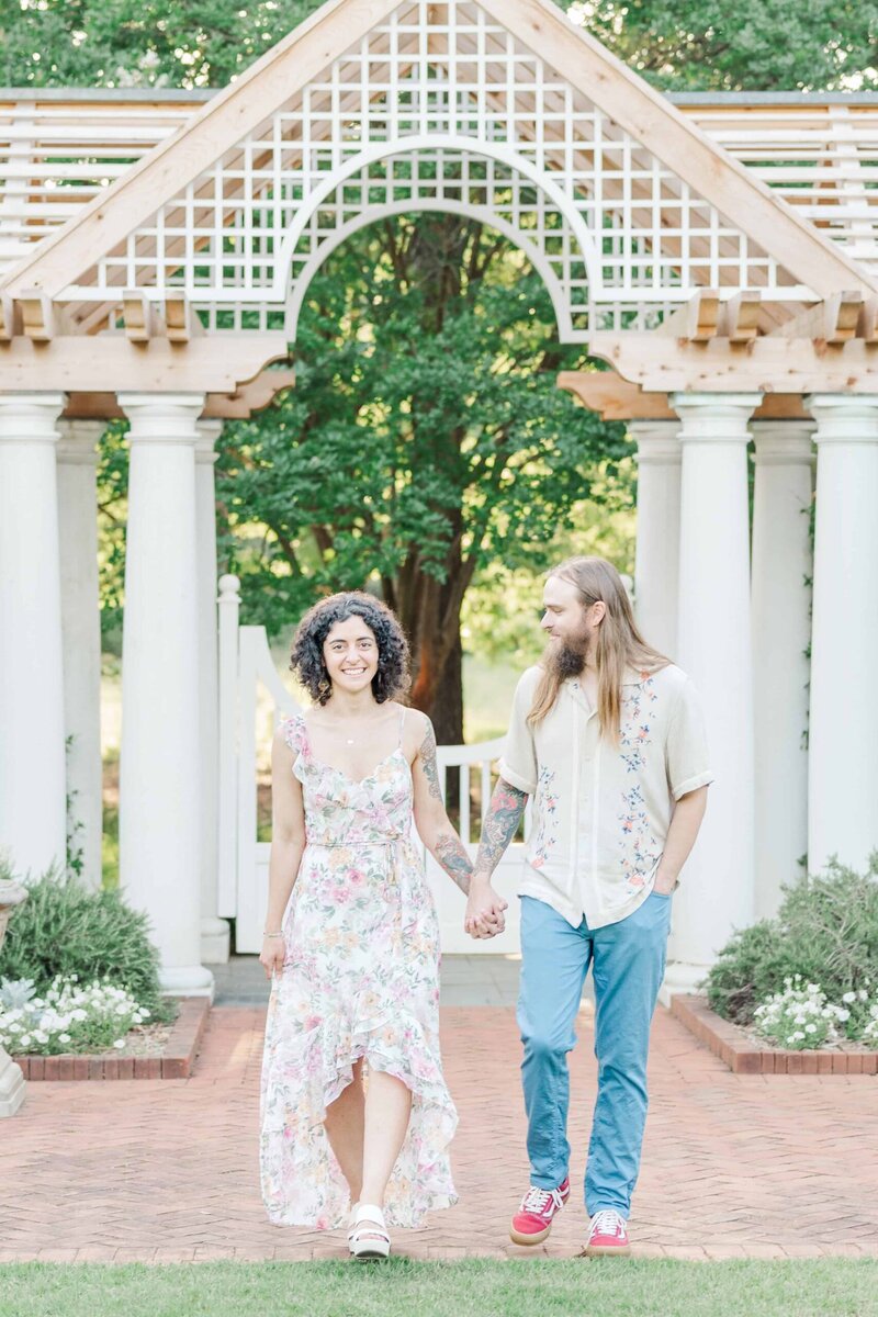 Romantic garden engagement photo at Daniel Stowe Conservancy near Uptown Charlotte