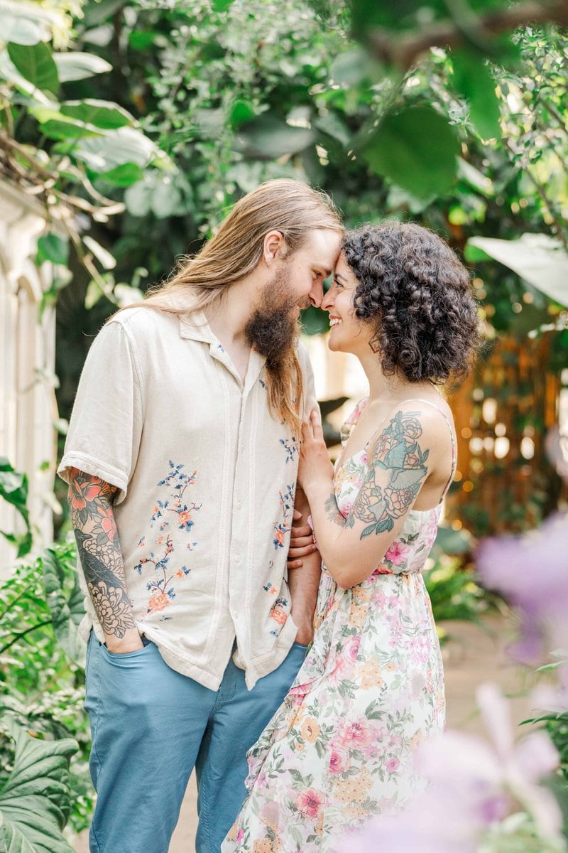 Close-up of engaged couple under tropical plants in the William H. Williamson, III Conservatory