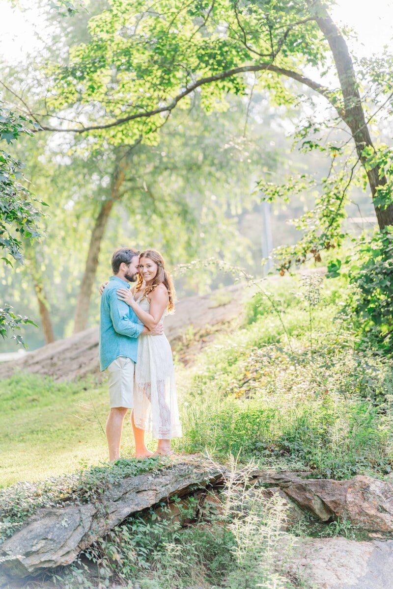McGalliard Falls waterfall surrounded by lush green summer trees in Valdese NC