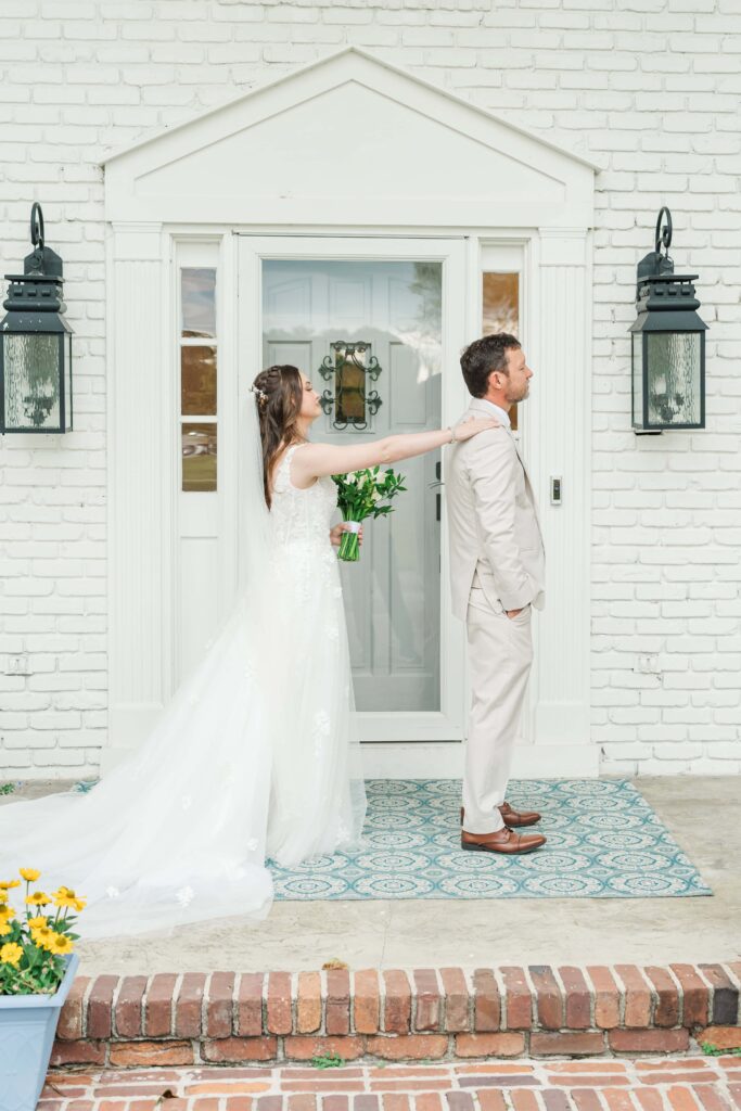 Bride and father first look on the front porch at Heron Hill Venue