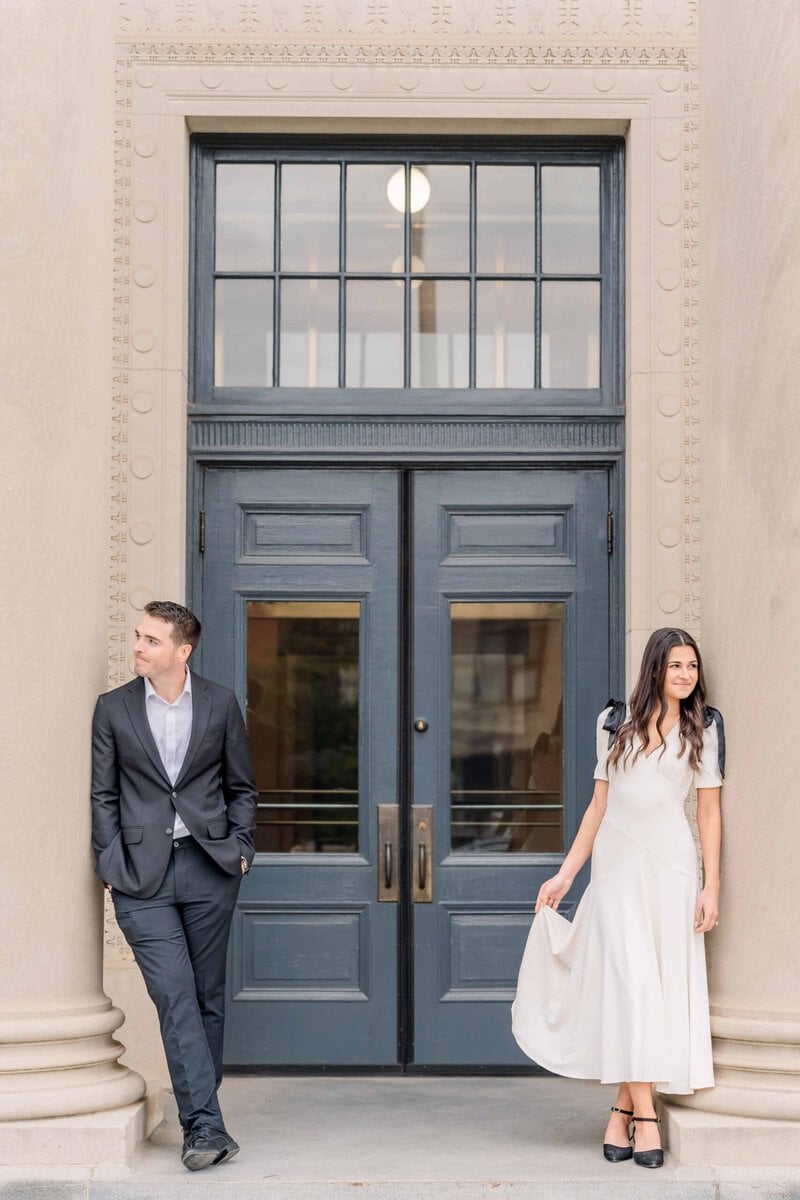 Beautiful couple posing at federal courthouse during Charlotte engagement session