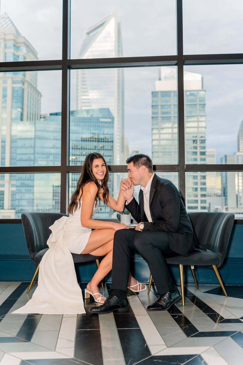 Couple enjoying each other's company with the Charlotte city skyline in the background