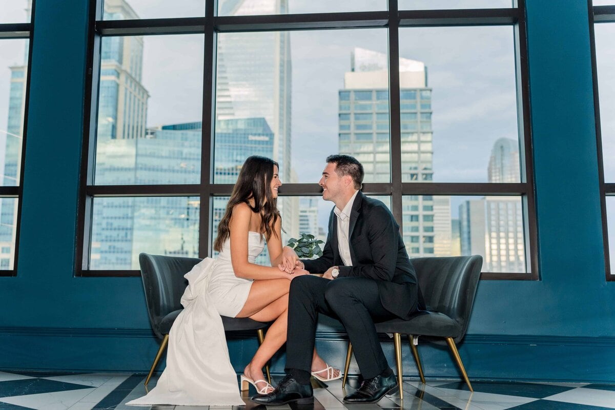 Romantic photo of couple with Charlotte skyline in the background